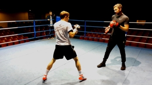 Andy Lee works the pads with Eric Donovan at the National Stadium