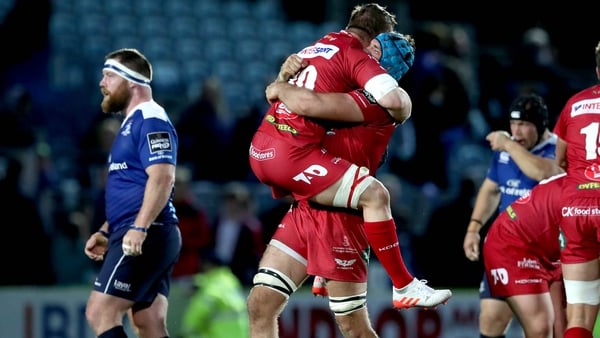 Leinster's Michael Bent cuts a dejected figure as Scarlets celebrate
