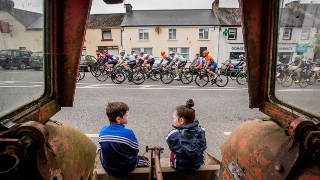 Luke and Caoimhe Conaty from Ballyjamesduff watch the riders pass through the village