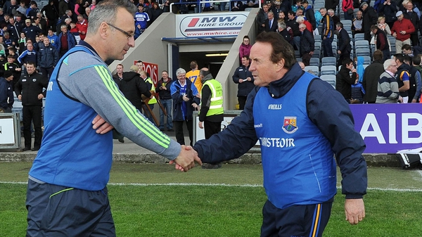 Managers Peter Creedon of Laois and Denis Connerton of Longford shake hands after the game