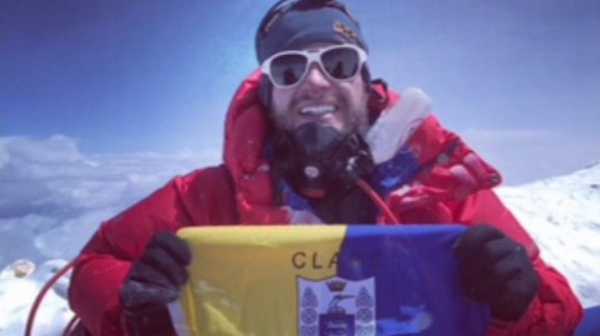 John Burke sits with his Clare flag at the top of Mount Everest last week
