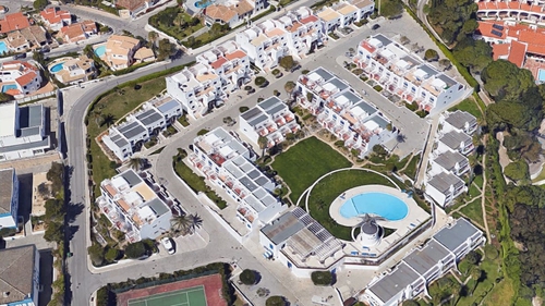 The man was found by friends at his residence in the Alto do Moinho apartments in Albufeira (Pic: Google Maps)