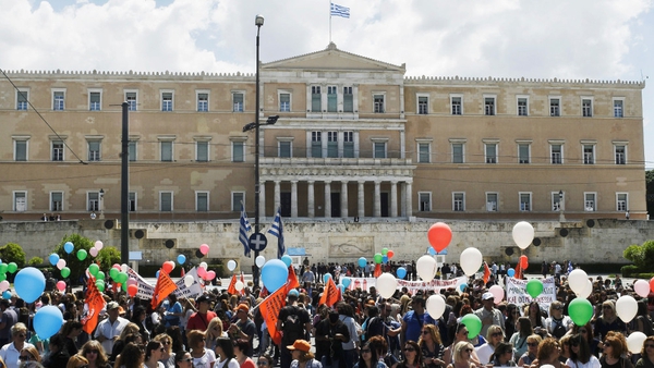 Employees from the municipal kindergardens protest outside the Greek parliament during a 48-hour strike