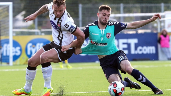 Paddy Barrett and Nathan Boyle challenge for possession