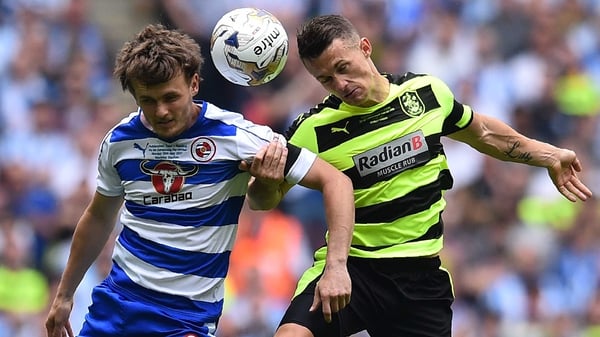 John Swift of Reading and Jonathan Hogg of Huddersfield rise for a header