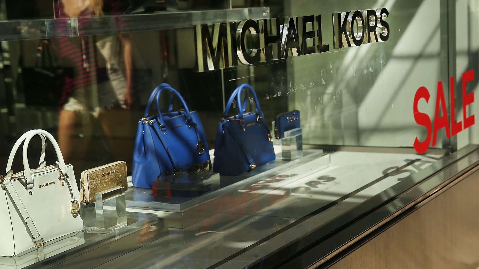 85 billion acquisition puts fashion giants Versace Coach and Michael Kors  under one company  CBS News