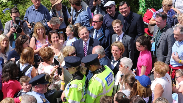 An Taoiseach Enda Kenny is surrounded by happy Bloom visitors