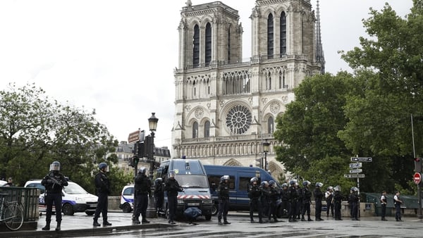 Police install a security parameter outside of Notre Dame cathedral after the attack