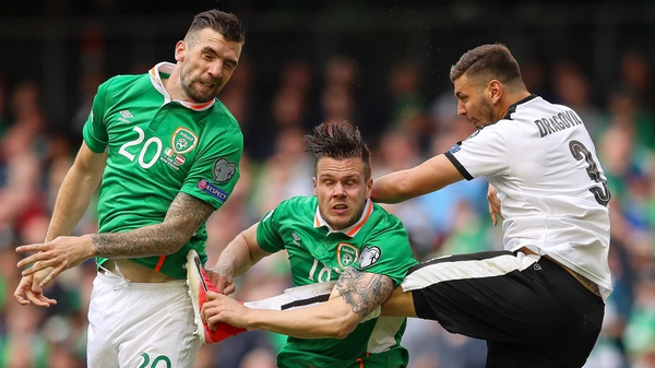 Shane Duffy (L) and Kevin Long rise to head clear