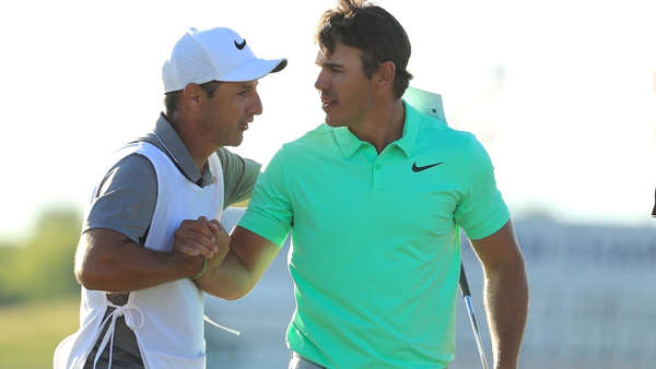 Elliott and Koepka embrace after winning the US Open