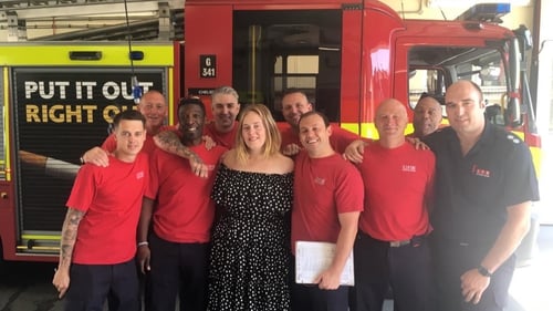 Adele with some of the firefighters that fought the blaze at the Grenfell Tower block in London. Pic: London Fire Brigade Twitter