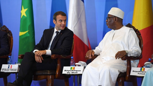 France's President Emmanuel Macron (left) speaks to Mali's President Ibrahim Boubacar Keita, as part of the summit, in Bamako, Mali, today