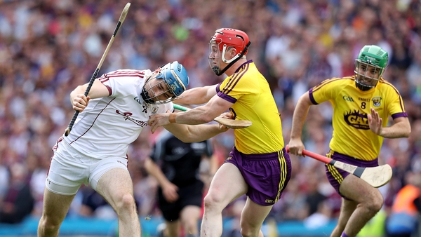 Galway's Conor Cooney with Willie Devereux of Wexford