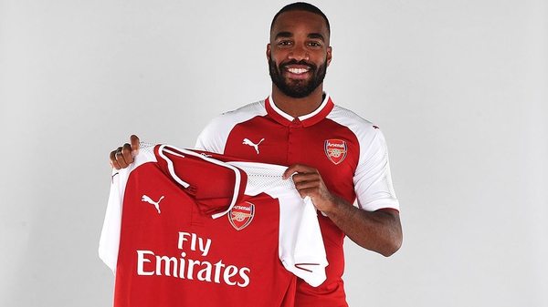 Alexandre Lacazette poses with his new club's shirt. Pic: Arsenal.com