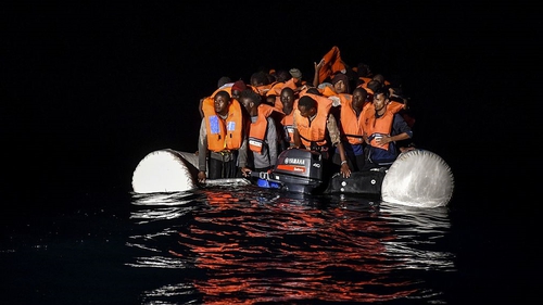 Migrants on a rubber vessel off the Libyan coast