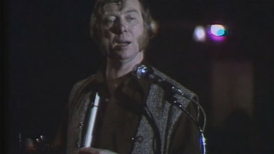 Tommy Makem performing on stage