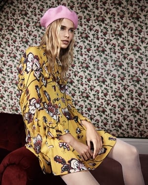 Carrying the floral theme of summer into winter is this bright day dress paired with a pastel beret from Penneys.