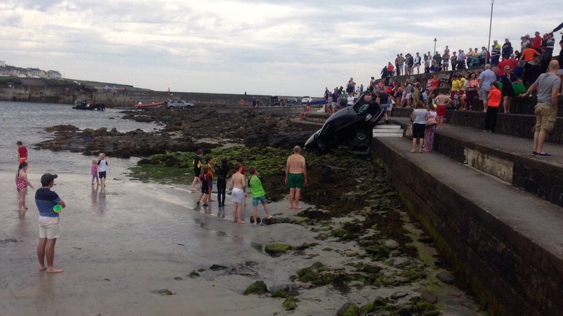 Car drives down crowded steps at popular Clare beach