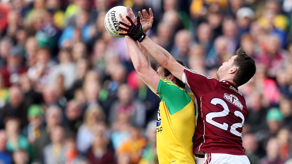 Galway's Ian Burke with Caolan Ward of Donegal