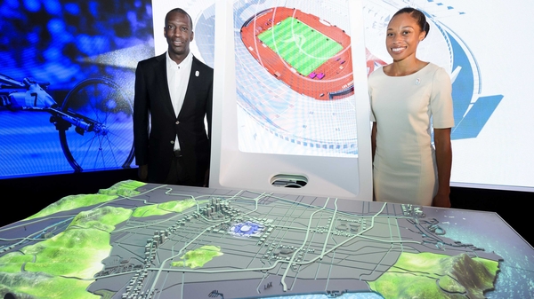 Michael Johnson (L) and Allyson Felix pose next to a scale model of Los Angeles during the presentation of Los Angeles 2024 Olympic bid's showroom in Lausanne earlier this month