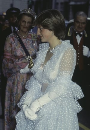 Lady Diana Spencer attends a banquet given at Claridge's hotel for King Khalid of Saudi Arabia in an Emmanuel gown.