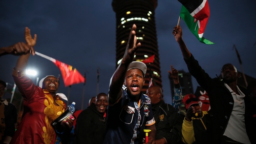 Supporters of Uhuru Kenyatta cheer in downtown Nairobi, Kenya