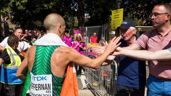 Rob Heffernan goes to his supporters after crossing the line in London