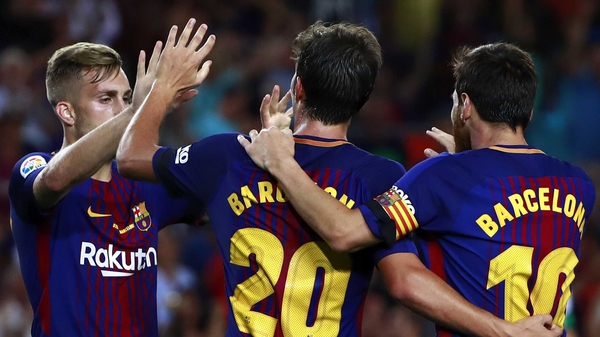 Sergi Roberto (C) celebrates scoring Barca's second goal with Lionel Messi (R) and Gerard Deulofeu (L)