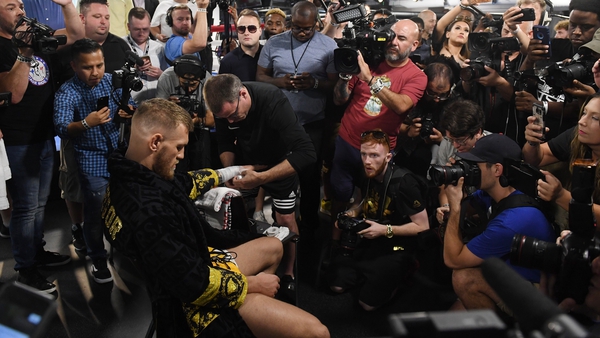 Conor McGregor getting his hands wrapped ahead of a media workout