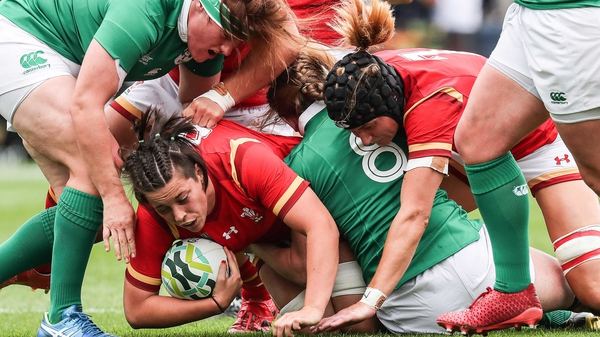 Sioned Harries burrows over for a Welsh try