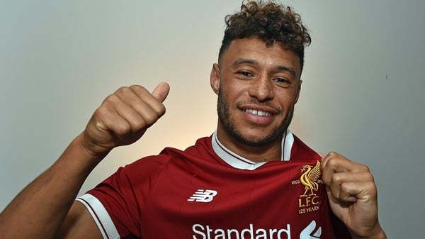 Alex Oxlade-Chamberlain poses in his Liverpool shirt