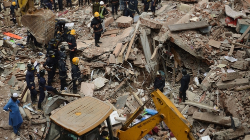 Police have yet to determine what caused the crumbling of the building in a densely-populated area of the city
