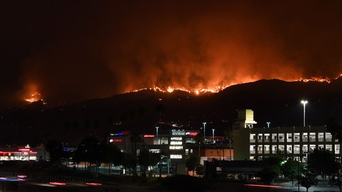The La Tuna Canyon fire burns in the hills above Burbank, California