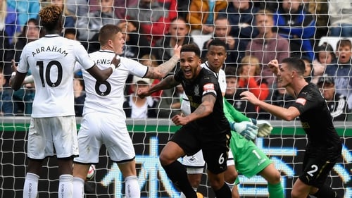 Newcastle goalscorer Jamaal Lascelles wheels away in celebration