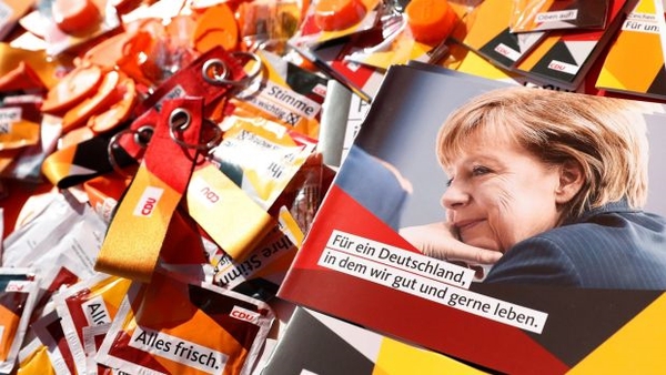 German chancellor Angela Merkel on brochures and election paraphernalia. Photo: Felipe Trueba/EPA