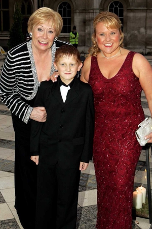 Liz and Corrie co-stars Sam Aston and Wendi Peters arrive at ITV's 50th Anniversary Royal Reception at the Guildhall on October 13, 2005 in London.