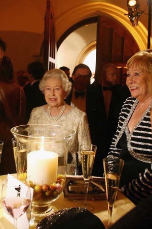 Britain's Queen Elizabeth II chats to guests at the ITV 50th Anniversary celebration, including Liz (right) 2005.