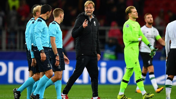 Jurgen Klopp argues with referee Clement Turpin after the full-time whistle