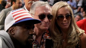 Rapper Kanye West, Hugh Hefner and Kendra Wilkinson at the 2008 NBA Finals