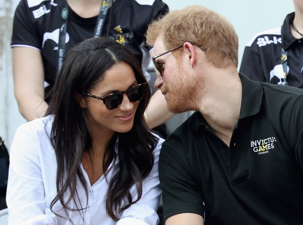 Prince Harry (R) and Meghan Markle (L) attend a Wheelchair Tennis match during the Invictus Games 2017