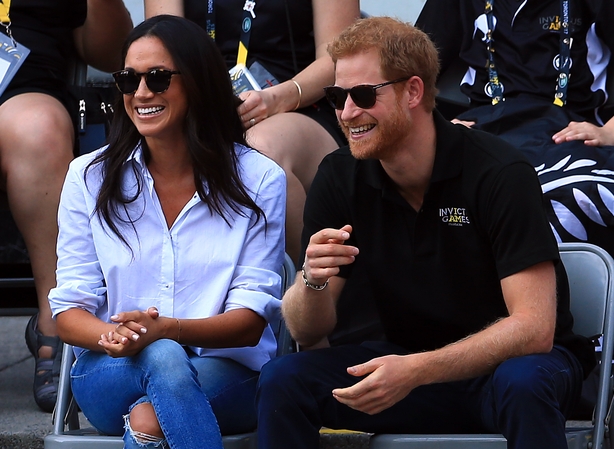 Prince Harry (R) and Meghan Markle