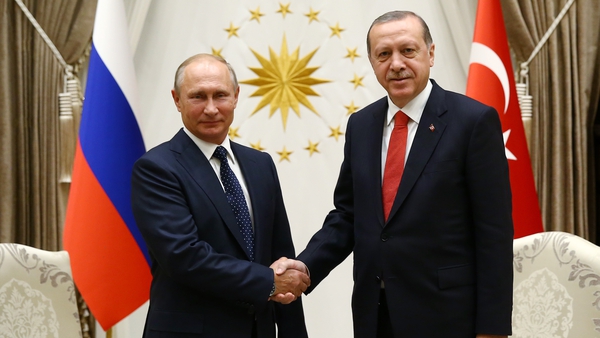 Vladimir Putin and Recep Erdogan pose before their meeting in Ankara
