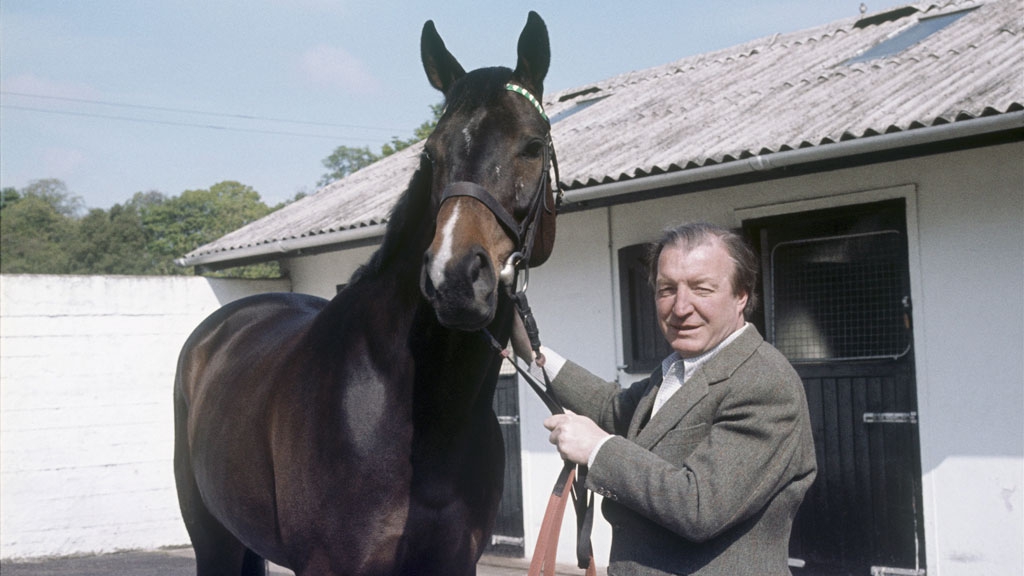 Charles Haughey holds a horse by the reins in the grounds of his home in Abbeville, Kinsealy, County Dublin, in a shot taken for RTÉ Television's 'People and Power' in May 1975.