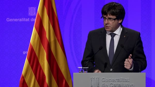 Carles Puigdemont faces arrest and possibly decades in jail if he returns to Spain