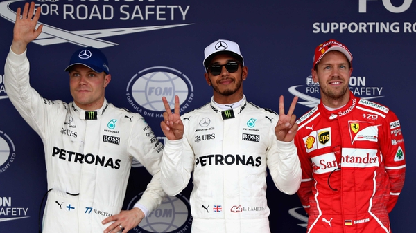 The top three qualifiers Lewis Hamilton of Mercedes (centre), Valtteri Bottas of Mercedes (L) and Sebastian Vettel of Ferrari (R)