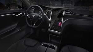 Tesla's huge infotainment screen is a class-leader. But how many functions should be available when driving ?