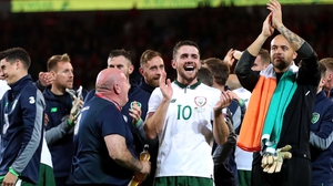 Robbie Brady salutes the fans after a famous win in Wales
