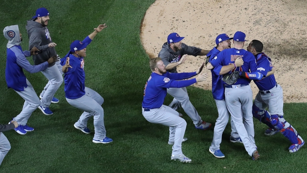 The Cubs celebrate their 9-8 victory
