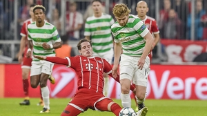Stuart Armstrong (R) is challenged by Bayern Munich's Sebastian Rudy
