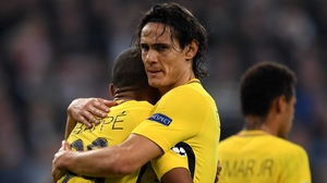 PSG's Edinson Cavani embraces Kylian Mbappe